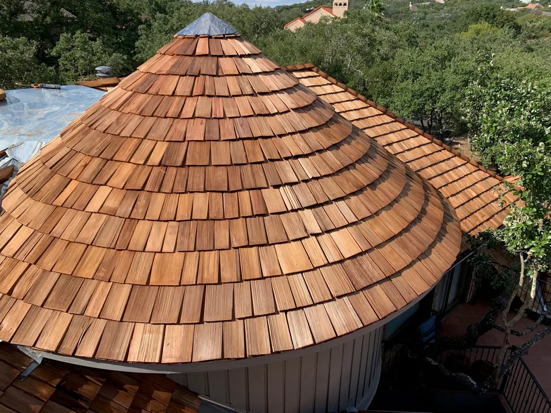 A round cedar-shake roof, each row of shakes laid in a curve